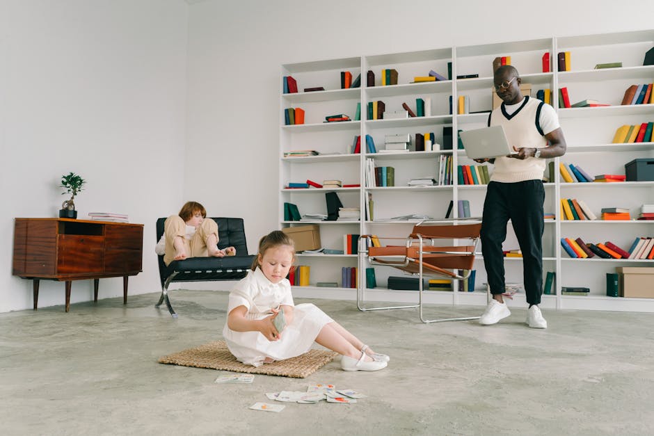 Child playing while adults work in a contemporary office library space.